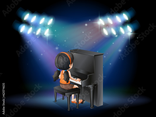 A stage with a young pianist performing