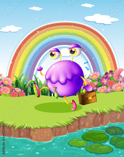 A monster walking near the pond with a rainbow in the sky