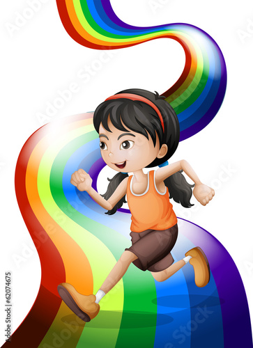 A rainbow with a young woman running