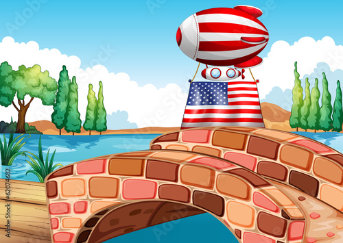 A balloon and the flag of the United States above the bridge