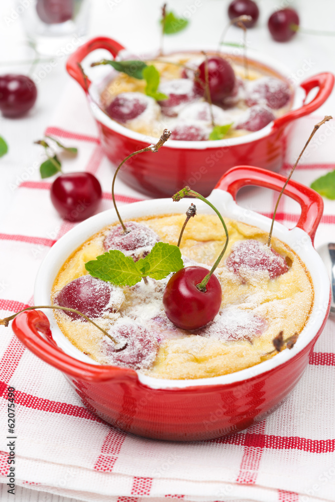 Casserole (clafoutis) with cherry in the ramekin Casserole (clafoutis) with cherry in the ramekin
