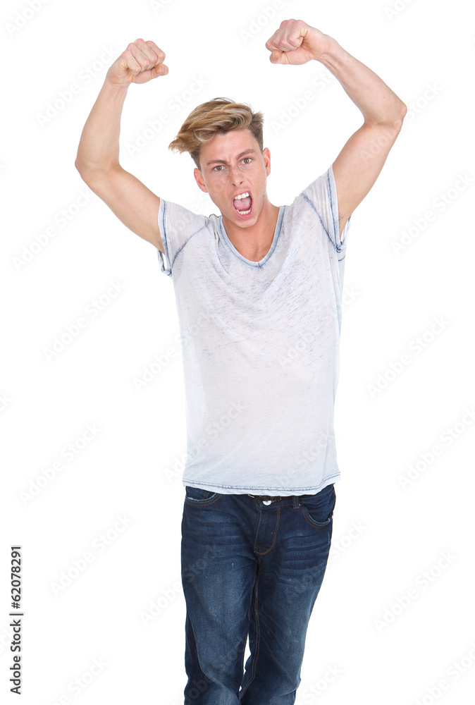 Young man celebrating with arms raised