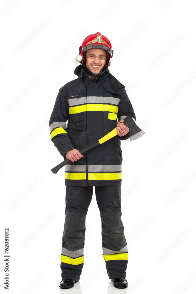 Firefighter posing with axe. Front view. Firefighter posing with axe. Front view.