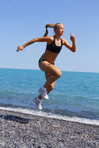 woman running sea beach