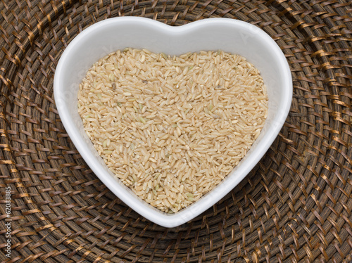 Brown rice in a heart shaped bowl