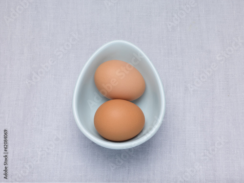 Two Eggs in an oval egg shaped bowl
