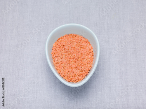 Red lentils, Petite crimson lentils in an oval bowl