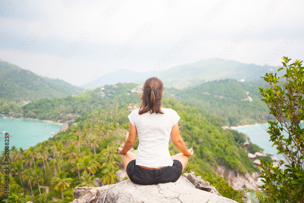 Yoga meditation in lotus pose by woman