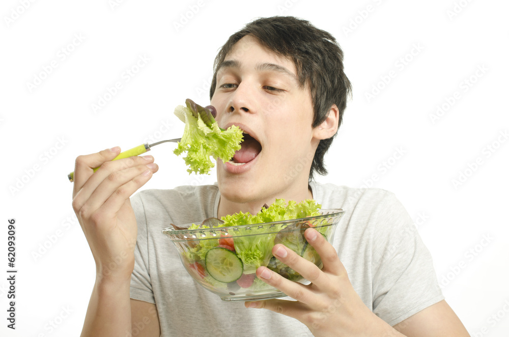 Man eating organic healty salad for perfect diet. Green for life Man eating organic healty salad for perfect diet. Green for life