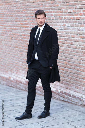 Photography young man posing with hands in pockets