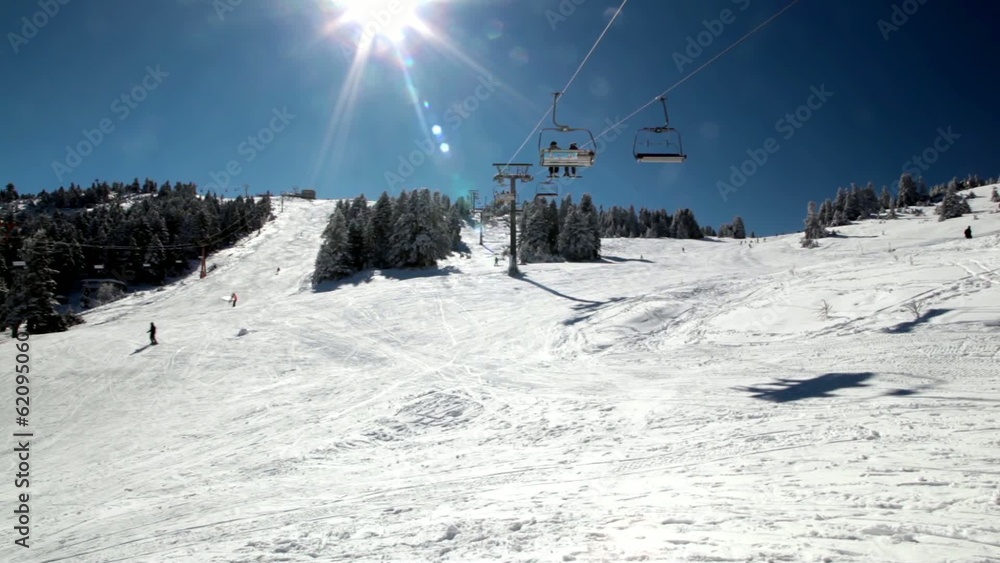 Ski Lift Moves Over The Snowy Mountain .Time Lapse. Ski Lift Moves Over The Snowy Mountain .Time Lapse.