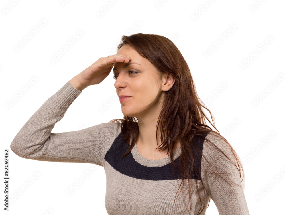 Young woman smiling as she peers into the distance Young woman smiling as she peers into the distance