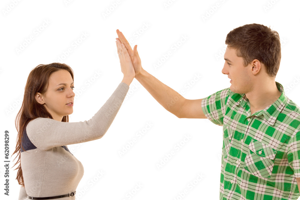 Attractive young couple congratulating themselves Attractive young couple congratulating themselves