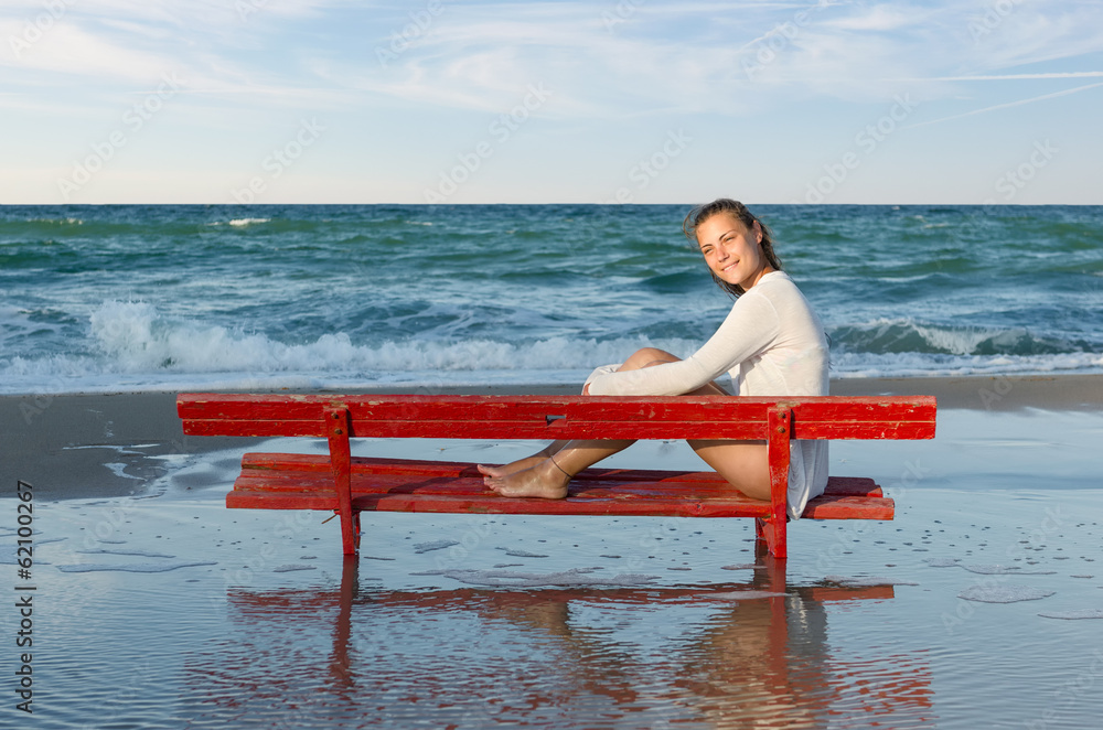 girl on a red bench