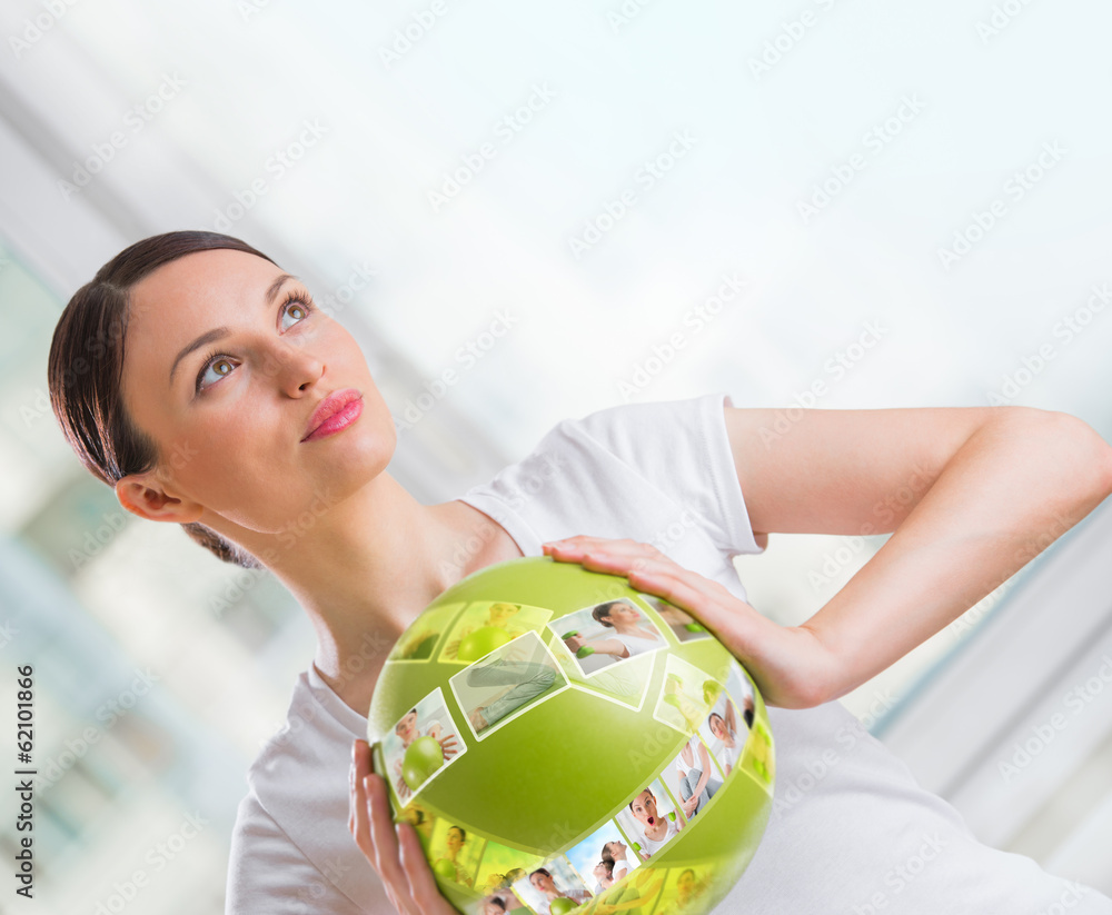 Woman with virtual pictures of her training program around her Woman with virtual pictures of her training program around her