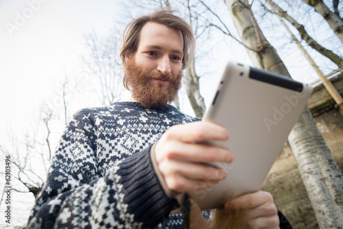 young bearded hipster man using tablet © Eugenio Marongiu