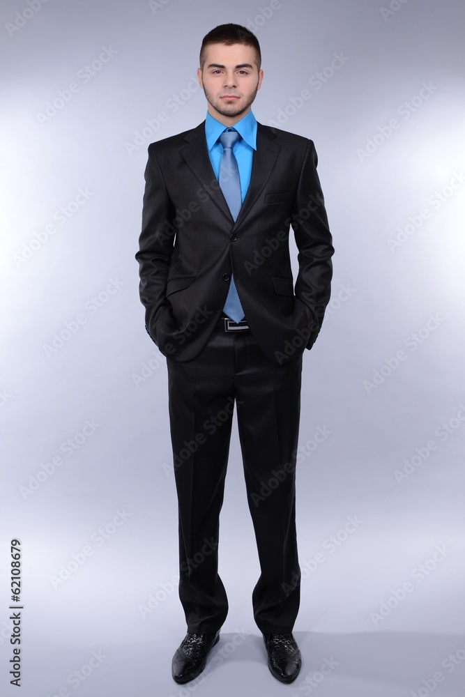 Business man on grey background Business man on grey background