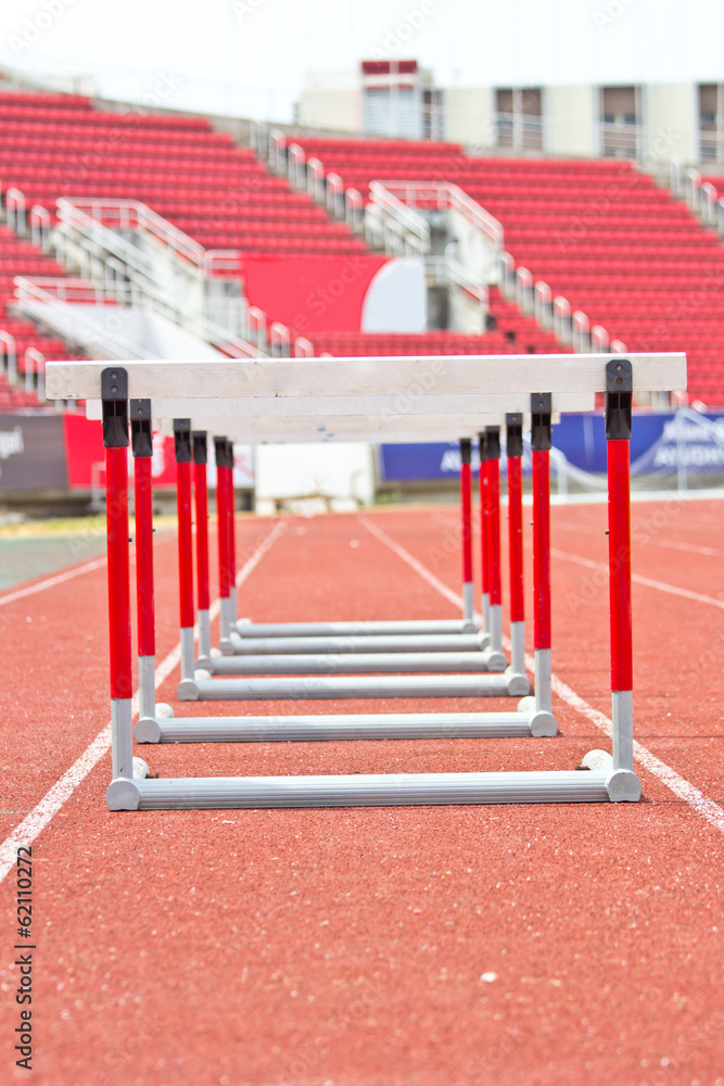 hurdles on the red running track hurdles on the red running track