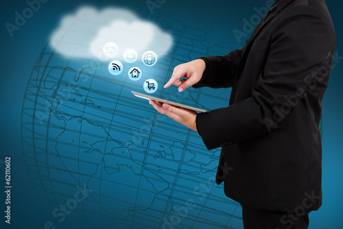 Businessman holding tablet show cloud computing concept on virtu photo