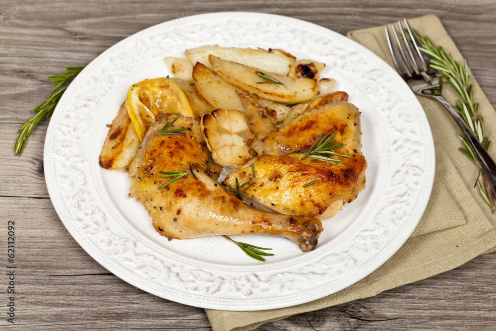 Chicken with Garlic, and Rosemary with potato. Selective focus.