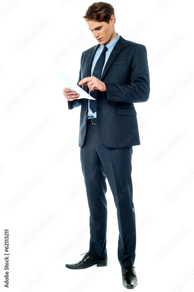 Businessman holding important deal documents Businessman holding important deal documents