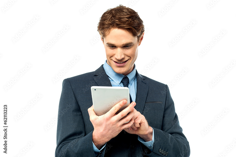 Corporate guy browsing on his tablet pc Corporate guy browsing on his tablet pc