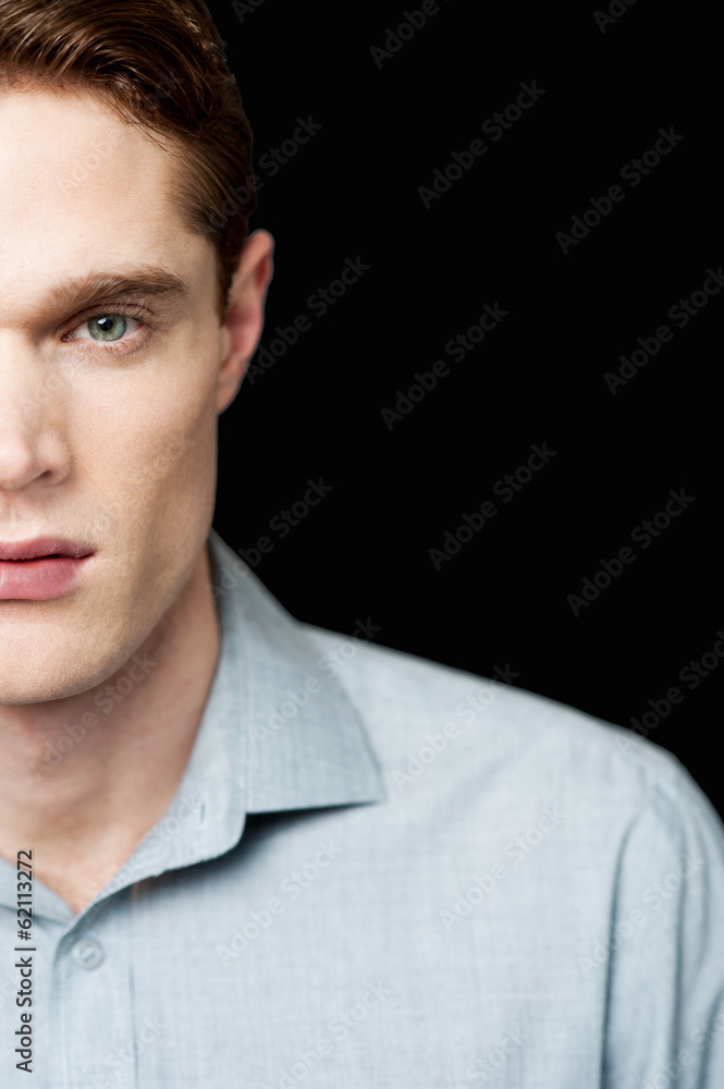 Fototapeta premium Half face portrait of a smart guy