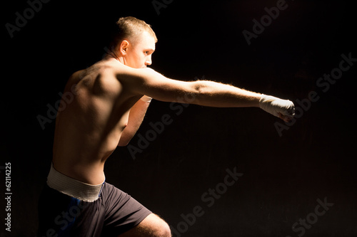 Boxer making a jabbing punch during a boxing match