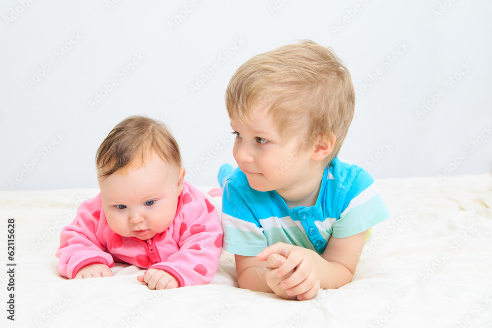 portrait of little boy with newborn sister portrait of little boy with newborn sister