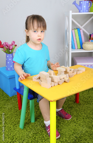 Little girl plays with cons...