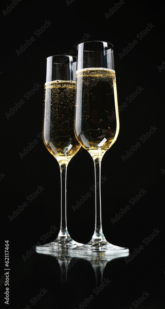 Glasses of champagne, on black background Glasses of champagne, on black background
