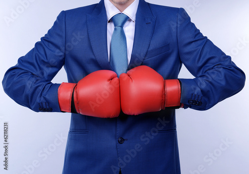 Business man on grey background © Africa Studio