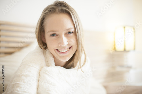 portrait of a beautiful young woman in her bedroom © jackfrog