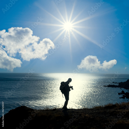 photographer silhouette on a sea coast