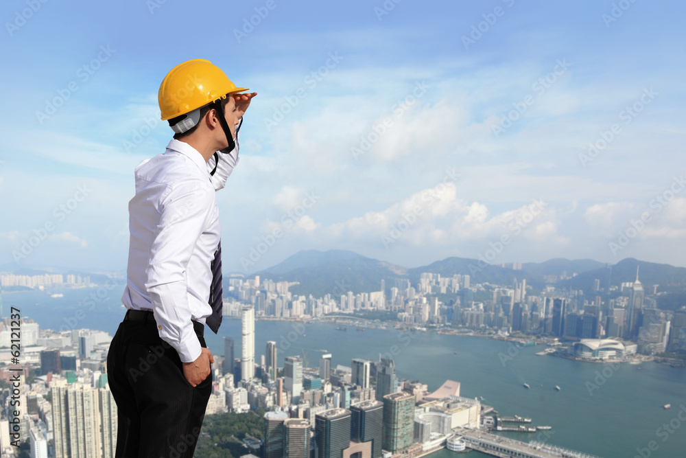 architect with helmet looking city building architect with helmet looking city building