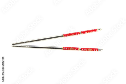 Stainless steel chopsticks with red pattern.