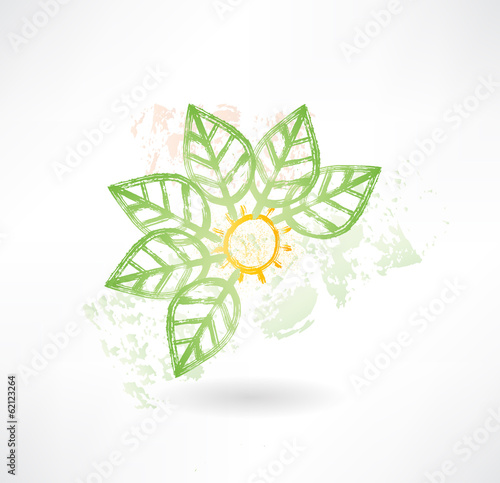 Brush icon with green leafs around