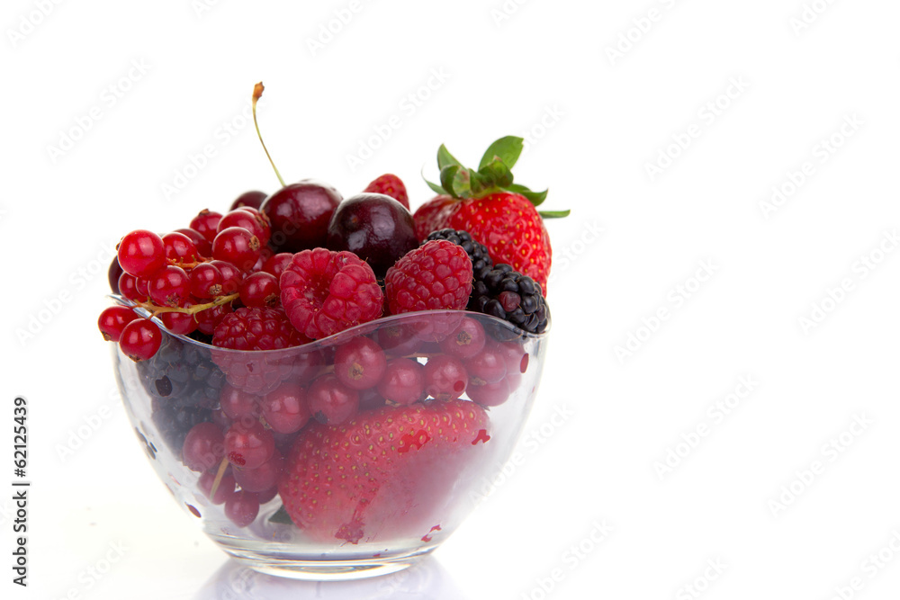 bowl of red summer fruits or berries. bowl of red summer fruits or berries.