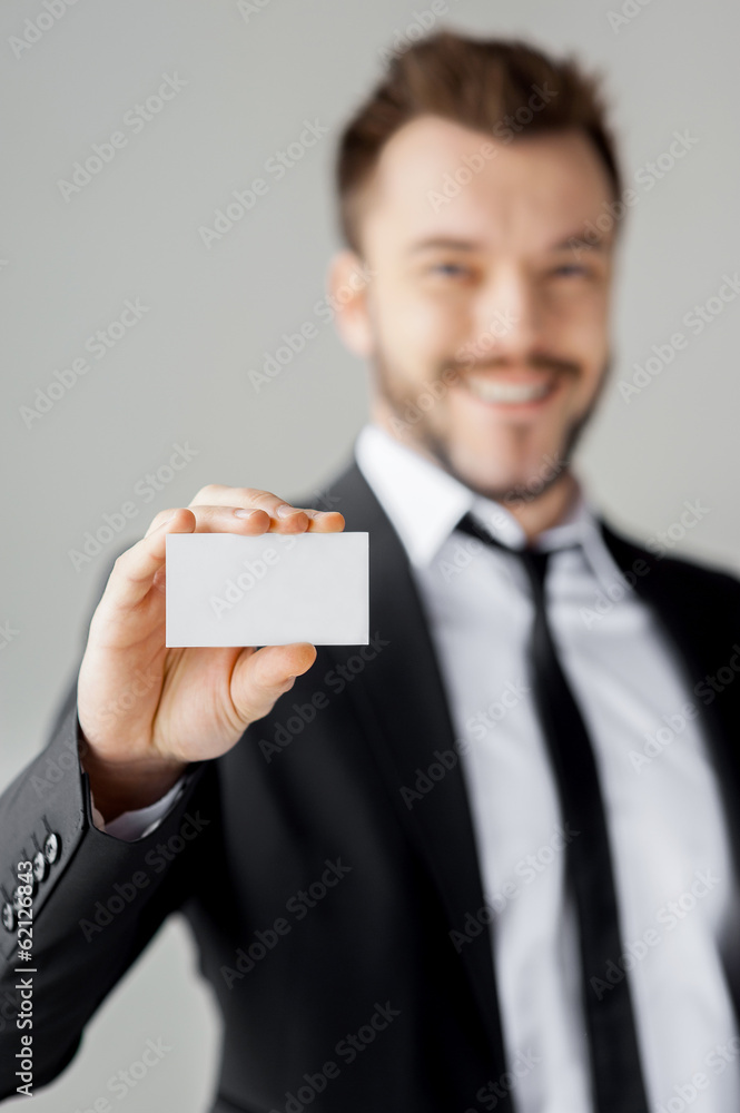 Man showing his business card. Man showing his business card.
