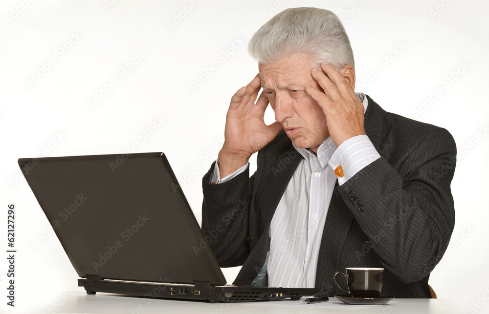 Mature man sitting at the computer Mature man sitting at the computer