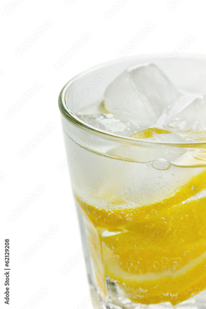 Water with lemons and ice cube isolated (selective focus) Water with lemons and ice cube isolated (selective focus)