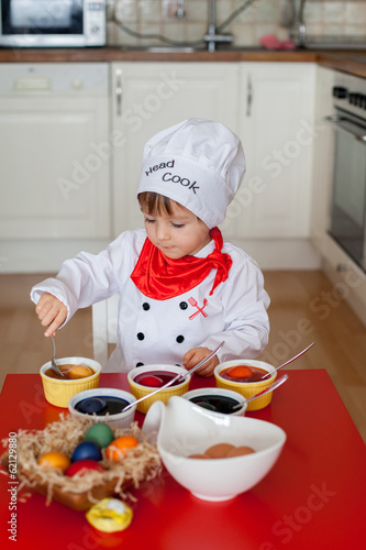 Little boy, coloring easter eggs