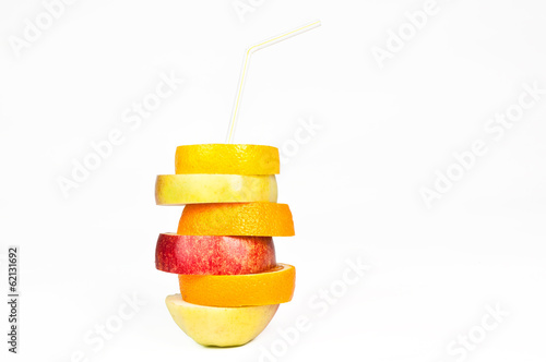 Stack of orange  lemon  pear and apple slices with straw juice c