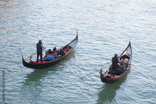 Two gondoliers in Venice