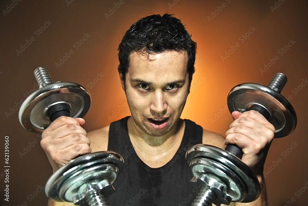 aggressive athlete training with dumbbells aggressive athlete training with dumbbells