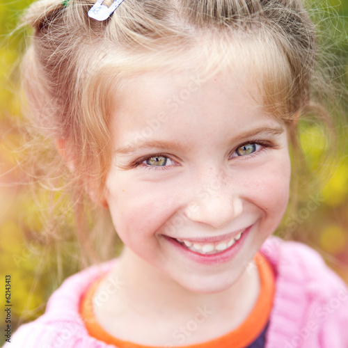 Portrait of a happy little cute girl