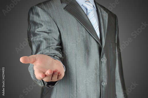 Man with stratched hand on dark background. photo