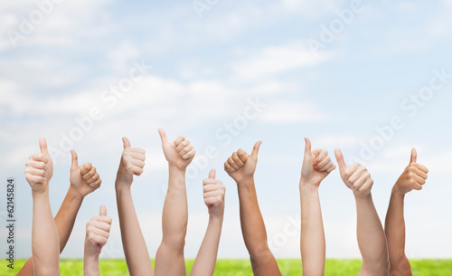 human hands showing thumbs up