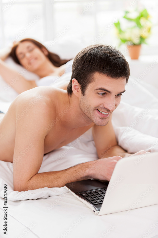 Surfing web in bed. Surfing web in bed.