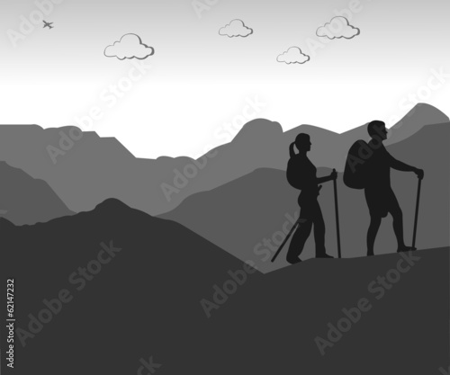 Mountain climbing  hiking couple with rucksacks silhouette
